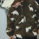 Konges Slojd bērnu flīsa jaka Joddy Teddy GRS Dinozaura siluets